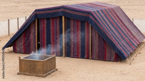 Biblical Tabernacle Exterior in the Desert- Ancient Mishkan Tent of Meeting with Smoking Altar.
