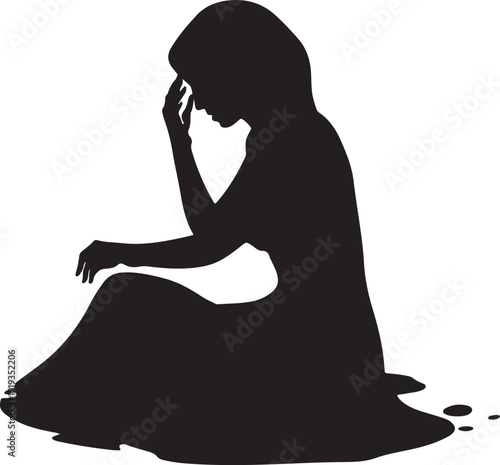 Silhouette of a person sitting with head resting on hand