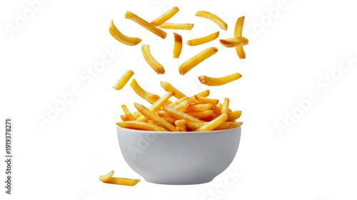 Crispy french fries falling into white bowl