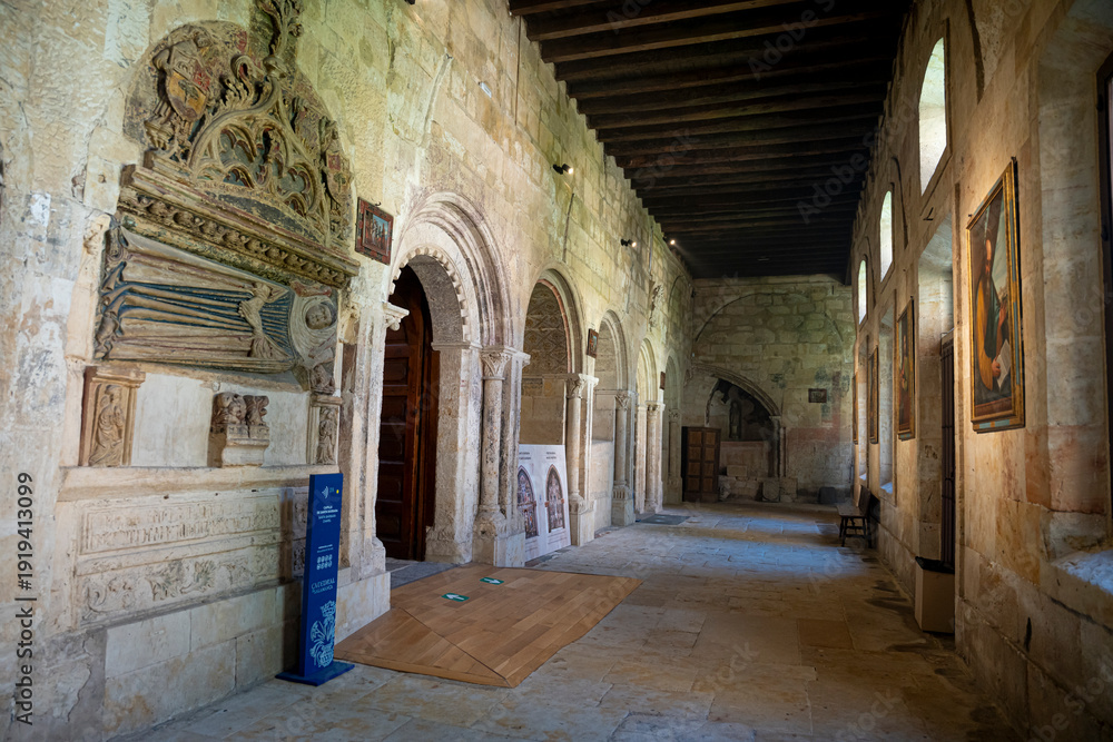 Obraz premium Interior of a historic stone building with arches.