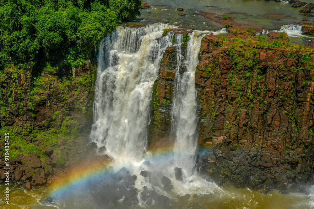 Obraz premium Rainbow in Iguazu falls waterfalls Scenic destination