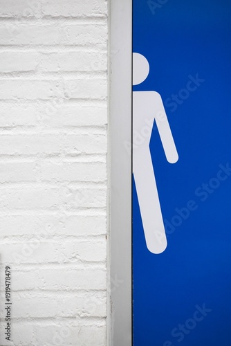 Male toilet restroom symbol on a wall