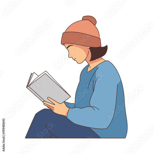 Young Person Reading Book Wearing Beanie and Blue Sweater