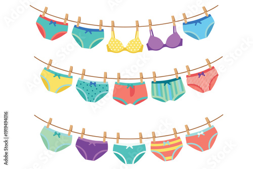 Assorted Childrens Underwear and Bras Hanging on Clothesline with Wooden Clothespins kids laundry