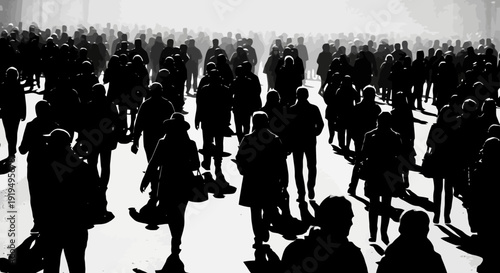 Large crowd of people silhouetted against bright light.
