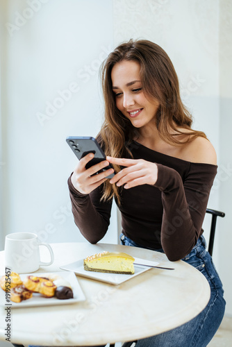 Young woman enjoys dessert ...