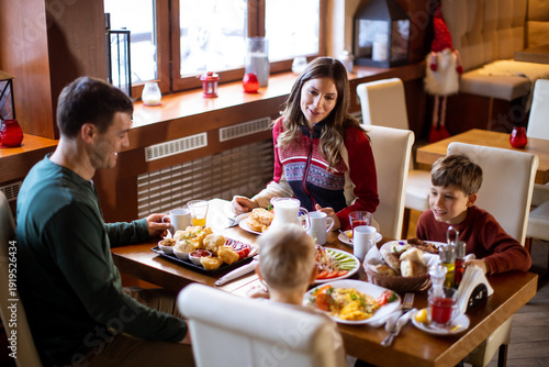Family enjoys breakfast tog...