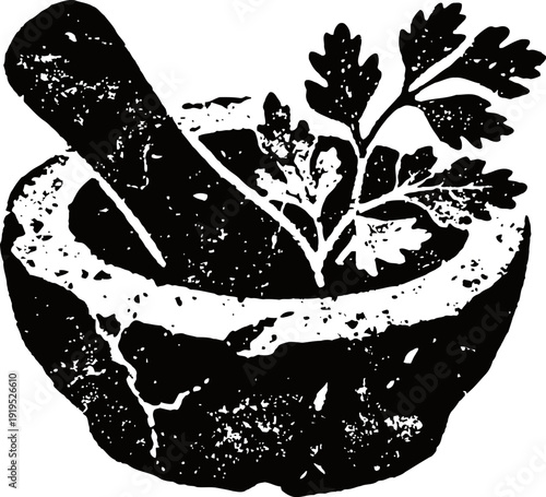 Ancient stone mortar and pestle with fresh herb leaves for grinding and mixing