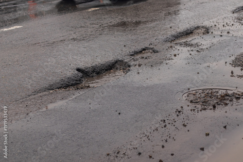 Tableau sur toile Horrible potholes in the road surface