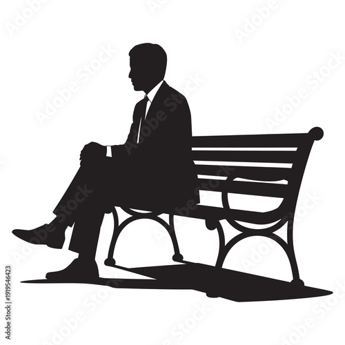 Silhouette of man sitting alone on park bench deep in thought during quiet moment