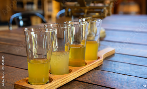 Closeup flight of heritage apple cider for delicious tasting near Hobart in Huon Valley of Tasmania, Australia