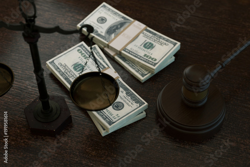 Quadro su tela powerful conceptual shot featuring stacks of US hundred dollar bills balanced on legal scales next to a wooden judges gavel