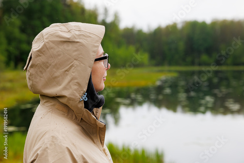 Canvastavla Quiet contemplation along the serene lake as rain gently falls under the shelter