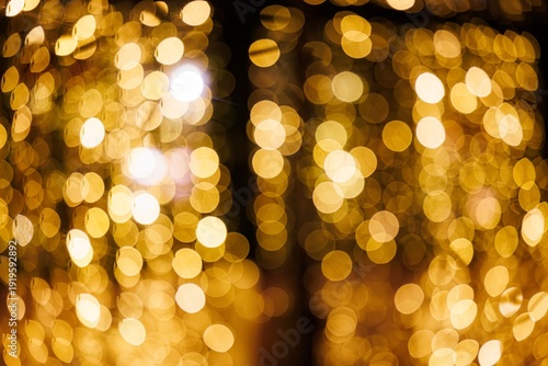 Slika na platnu Glistening golden orbs create a magical atmosphere during an evening celebration