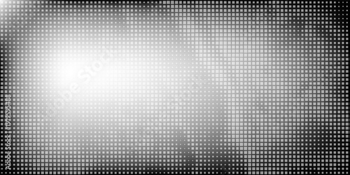 An abstract, irregular black shape composed of halftone dots. The dots are dense in the center and dissipate outwards, creating a gradient, grunge, and dissolving effect.