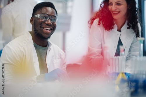 Wallpaper Mural Diverse scientists collaborating in research lab smiling Torontodigital.ca