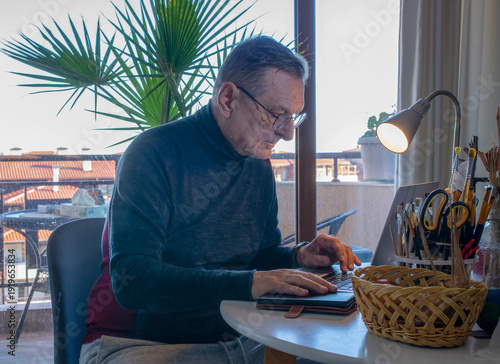 A man working at the computer 