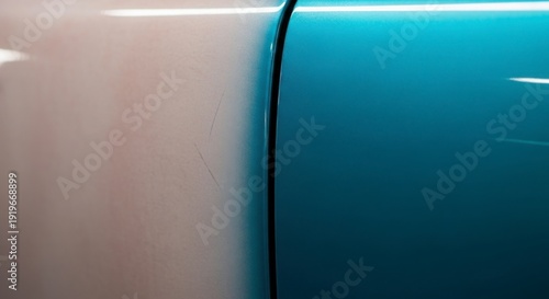 Damaged car door with scratch on white and blue vehicle