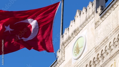 Wallpaper Mural Slow motion of the Turkish flag and the gate of Istanbul University against a cloudless blue sky. Torontodigital.ca
