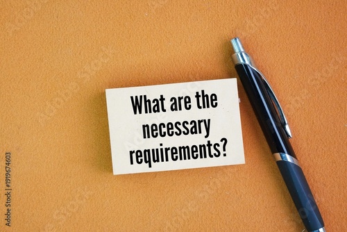 Tableau sur toile Pen and paper with the question words What are the necessary requirements?  the