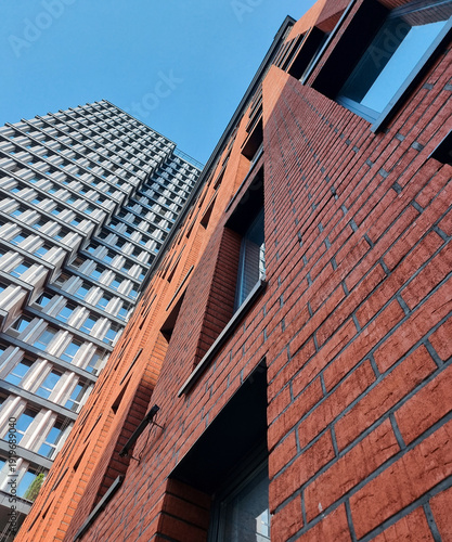 Принти на полотні Looking up at the facade of modern building with brick facade