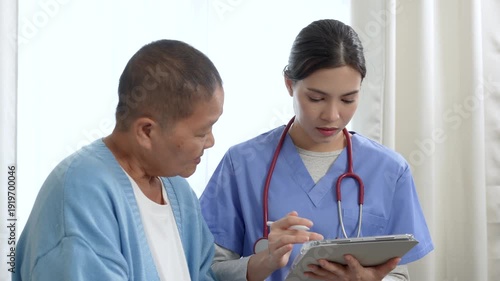 Caregiver, support worker look after senior woman patient, disability at nursing home. Elderly grandmother in wheelchair receiving physical therapy with support from female nurse therapist during the 