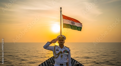 An Indian naval officer salutes proudly on a boat at sunset