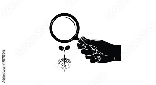 A hand holds a magnifying glass over a small seedling with roots.