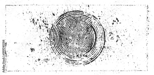 Concentric black circles forming a spiral pattern on a distressed white background with scattered dark speckles and a faint rectangular border