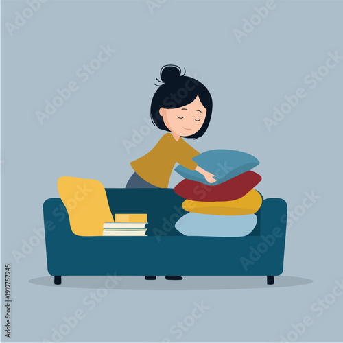 Young woman stacking colorful cushions on sofa.