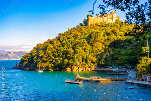 Bild auf Leinwand Hilltop castle above turquoise bay in Portofino, Italy