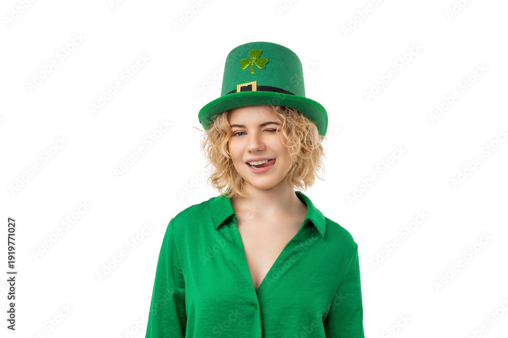 Fototapeta premium Woman in a green shirt and leprechaun hat winking, isolated, PNG
