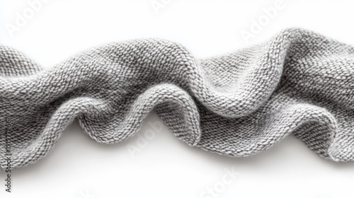 Professional product photography of pearl gray merino wool fabric arranged in gentle waves showing seamless repeating pattern of classic stockinette stitch, subtle natural variations in fiber