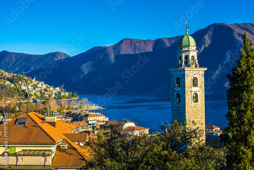 Bell tower overlooking Lake Lugano and surrounding mountains