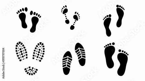 A collection of black footprints and shoe prints on a white background