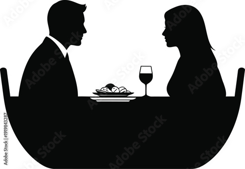 Couple enjoying a romantic dinner together at a table silhouette