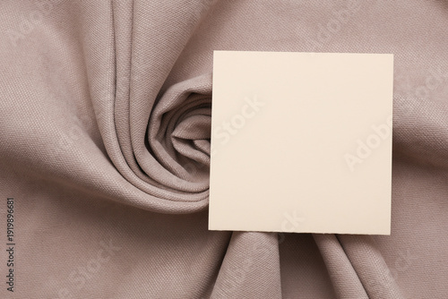 фотографія Blank card on Beige velor fabric background