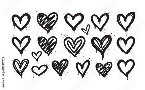Hand drawn graffiti style black and white heart symbols with spray drips