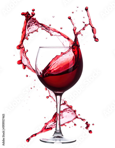 Red wine splashing into a glass on a black background