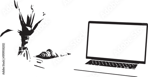 A modern workspace with a laptop and a vase of flowers on a desk.