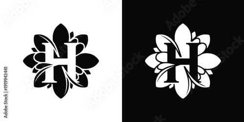 Black and white floral monogram with letter H surrounded by stylized leaves and petals