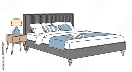 Contemporary bedroom interior with a stylish gray tufted bed accompanied by a blue runner pillows and a matching lamp on a wooden nightstand.