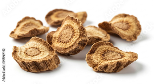 Dried mushroom slices on white background with natural lighting and soft shadows