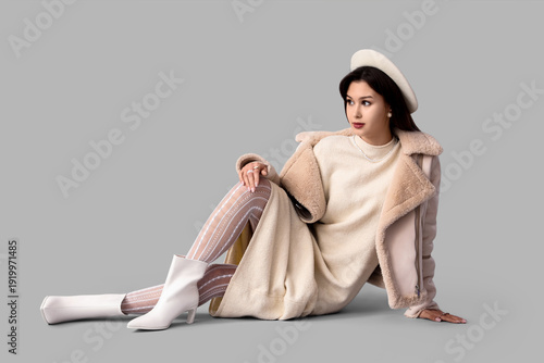 Stylish young woman in whit...