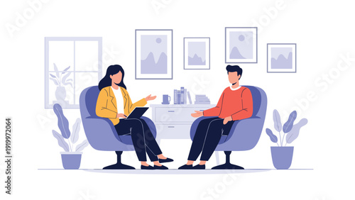 Professional woman in an armchair listens to a man sitting across from her in a cozy office with books and paintings.