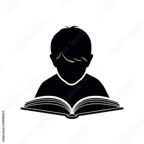 Silhouette of a young boy reading an open book symbolizing education and learning.