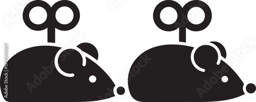 Two charming black wind-up mouse toys, evoking nostalgia and playful childhood memories.