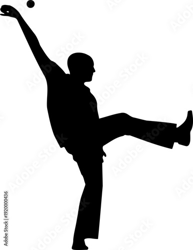 A black silhouette of a man kicking a ball in a dynamic pose