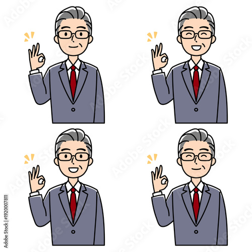 笑顔でOKサインをするスーツの壮年男性（カラー）