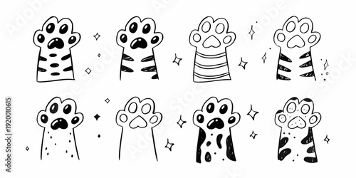 Collection of hand drawn cat paw prints with varying patterns and details